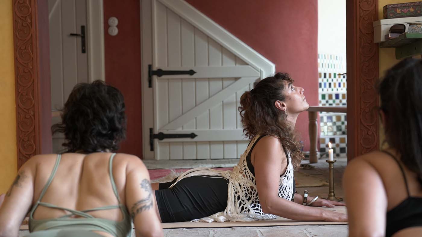 A guided yoga practice in an intimate setting